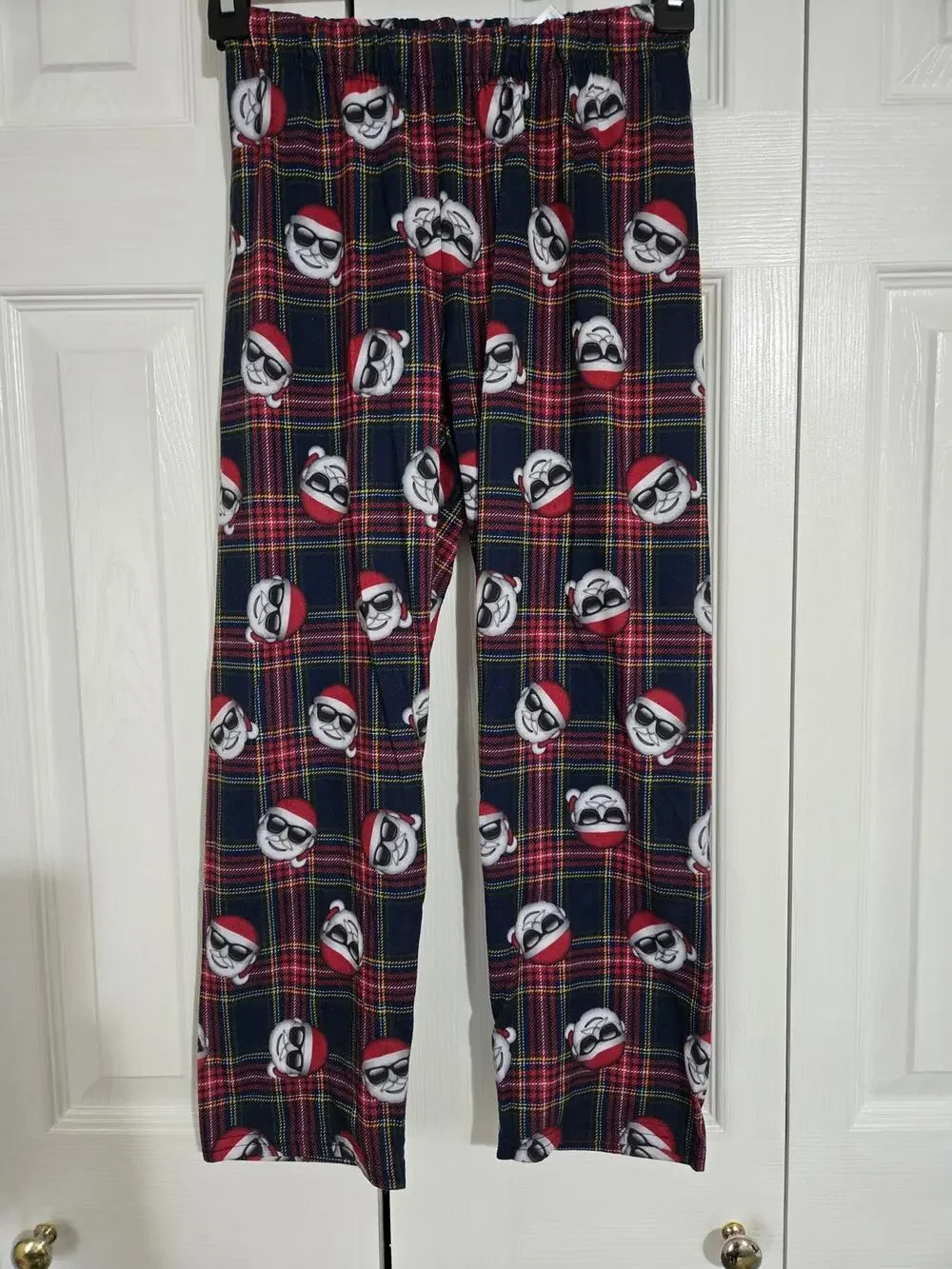 The children's place size 7/8 plaid Santa pajama bottoms
